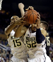 Jon Horford (15) and Jordan Morgan (52)