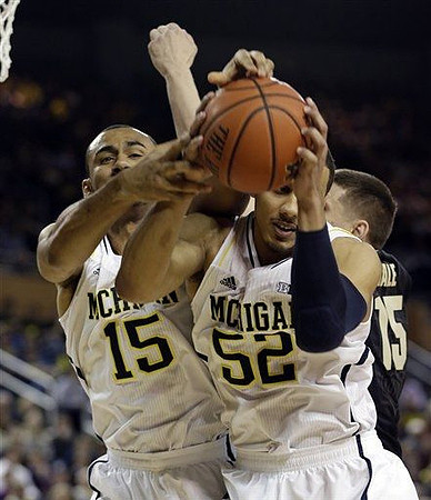 Jon Horford (15) and Jordan Morgan (52)