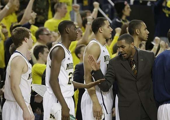 Spike Albrecht (2), Caris LeVert (23), Jordan Morgan (52), LaVall Jordan, and Jon Horford (15)