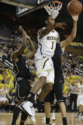 Glenn Robinson III (1) and Trey Burke (3)