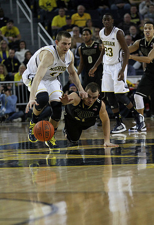 Nik Stauskas (11) and Caris LeVert (23)