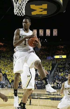 Glenn Robinson III (1) and Trey Burke (3)