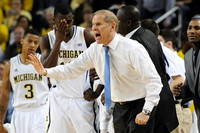 Trey Burke (3), Tim Hardaway Jr. (10), John Beilein, Bacari Alexander, and LaVall Jordan
