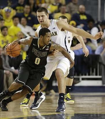 Mitch McGary (4) and Nik Stauskas (11)