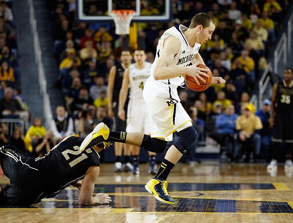 Nik Stauskas (11) and Mitch McGary (4)