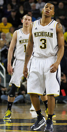 Trey Burke (3) and Nik Stauskas (11)