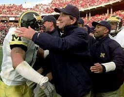 Lloyd Carr, Larry Foote (17), and Erik Campbell