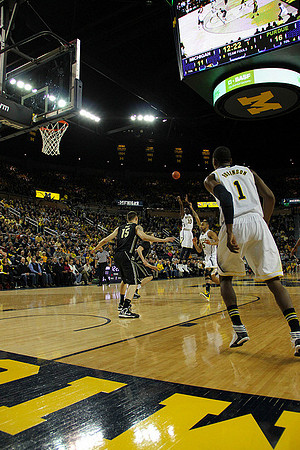 Tim Hardaway Jr. (10), Jon Horford (15), and Glenn Robinson III (1)