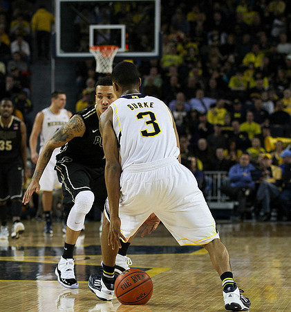 Trey Burke (3) and Mitch McGary (4)