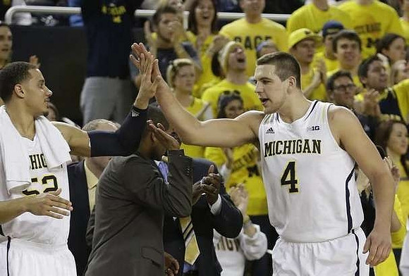 Jordan Morgan (52), LaVall Jordan, and Mitch McGary (4)