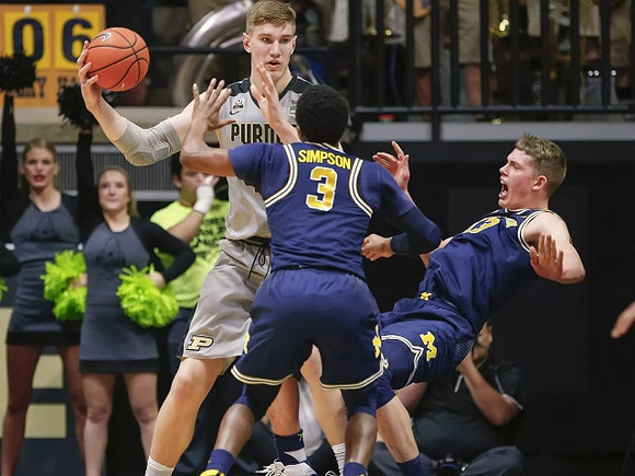 Zavier Simpson (3) and Moritz Wagner (13)