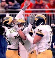 Julius Curry (26), Todd Howard (3), and Larry Foote (17)