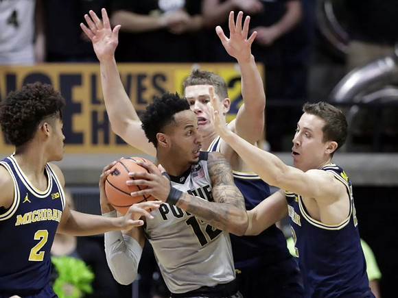 Jordan Poole (2), Moritz Wagner (13), and Duncan Robinson (22)