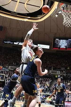 Zavier Simpson (3), Jon Teske (15), and Muhammad-Ali Abdur-Rahkman (12)