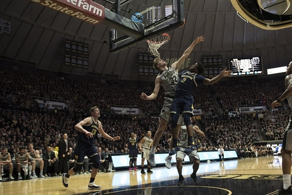 Zavier Simpson (3), Muhammad-Ali Abdur-Rahkman (12), and Moritz Wagner (13)