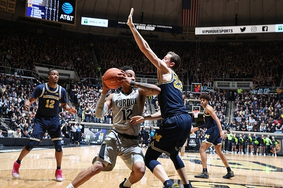 Muhammad-Ali Abdur-Rahkman (12), Duncan Robinson (22), and Jordan Poole (2)
