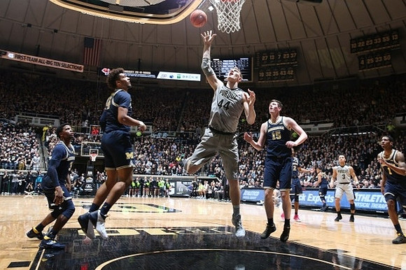 Zavier Simpson (3), Isaiah Livers (4), Jon Teske (15), and Charles Matthews (1)