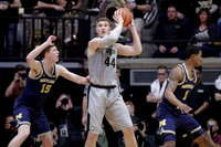 Jon Teske (15) and Charles Matthews (1)