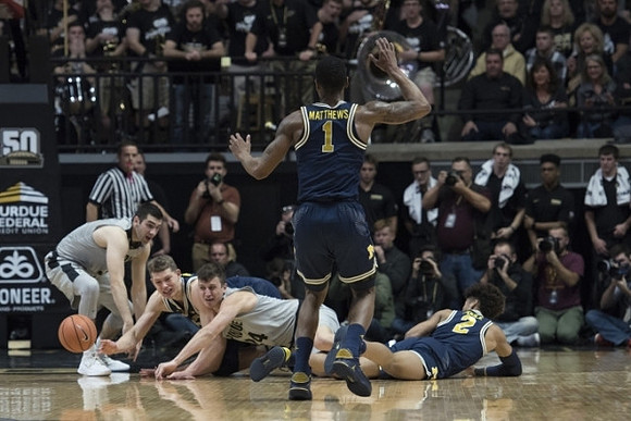 Charles Matthews (1), Moritz Wagner (13), and Jordan Poole (2)