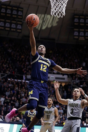 Muhammad-Ali Abdur-Rahkman (12) and Zavier Simpson (3)