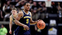 Jaaron Simmons (5) and Moritz Wagner (13)