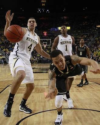 Mitch McGary (4) and Glenn Robinson III (1)