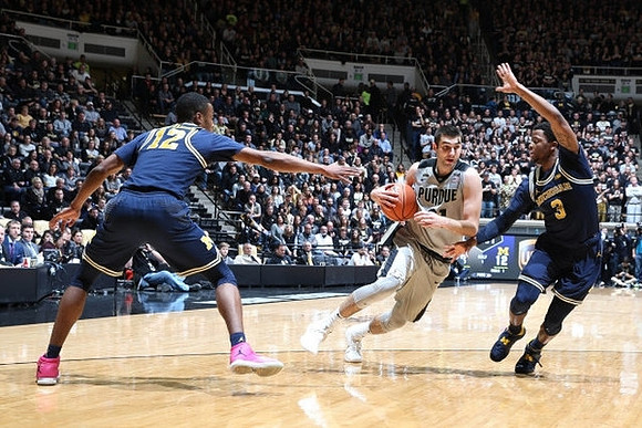 Muhammad-Ali Abdur-Rahkman (12) and Zavier Simpson (3)