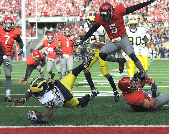 Denard Robinson (16) and Martell Webb (80)