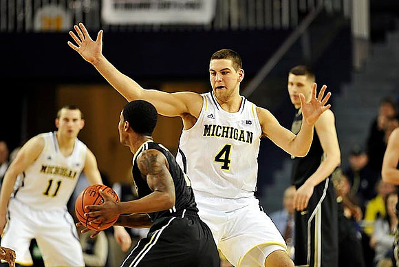 Nik Stauskas (11) and Mitch McGary (4)