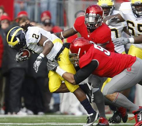 Vincent Smith (2) and Patrick Omameh (65)