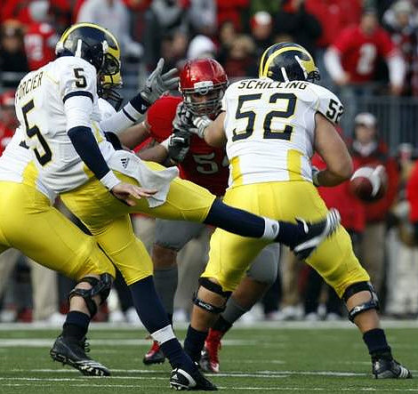 Tate Forcier (5) and Stephen Schilling (52)