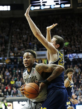 Duncan Robinson (22) and Jordan Poole (2)