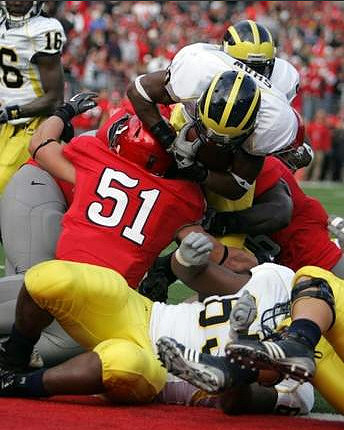 Denard Robinson (16), Michael Shaw (20), and Patrick Omameh (65)