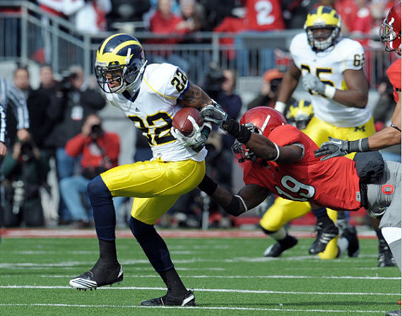 Darryl Stonum (22) and Patrick Omameh (65)