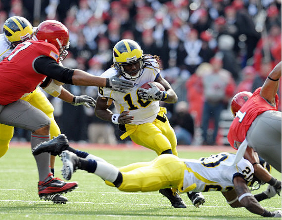Denard Robinson (16) and Michael Shaw (20)