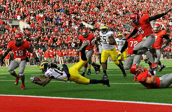 Denard Robinson (16), Patrick Omameh (65), and Perry Dorrestein (79)