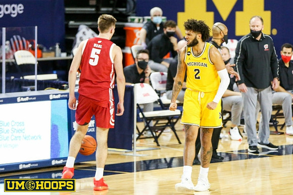 Isaiah Livers (2) and Wisconsin Head Coach Greg Gard