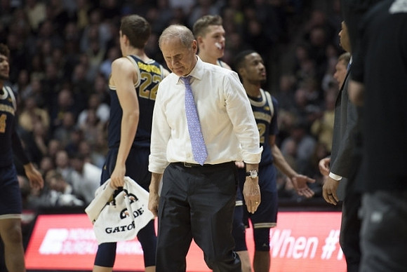 John Beilein, Duncan Robinson (22), Moritz Wagner (13), and Muhammad-Ali Abdur-Rahkman (12)