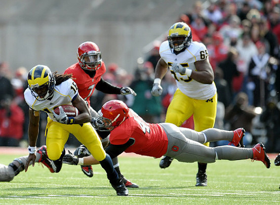 Denard Robinson (16) and Patrick Omameh (65)