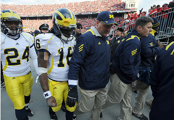 Cullen Christian (24), Denard Robinson (16), and Rich Rodriguez