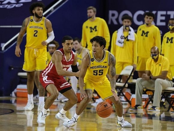 Eli Brooks (55) and Isaiah Livers (2)
