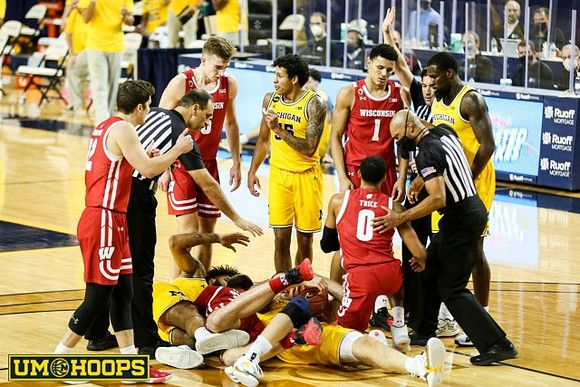 Isaiah Livers (2), Eli Brooks (55), and Chaundee Brown Jr. (15)