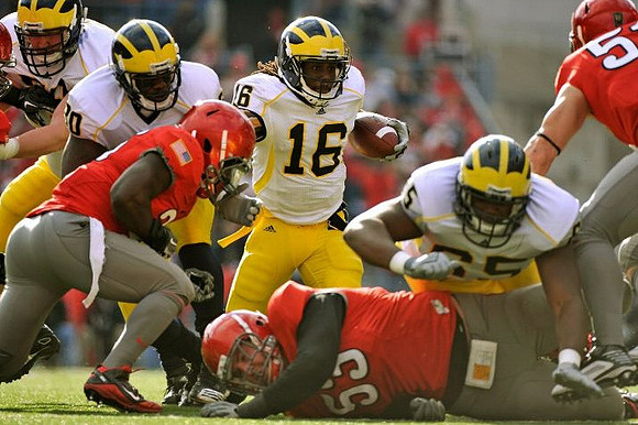 Denard Robinson (16), Michael Shaw (20), and Patrick Omameh (65)