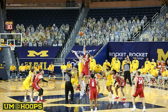 Franz Wagner (21), Mike Smith (12), Eli Brooks (55), Hunter Dickinson (1), and Isaiah Livers (2)