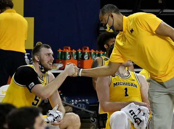 Austin Davis (51) and Juwan Howard