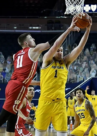 Hunter Dickinson (1) and Eli Brooks (55)