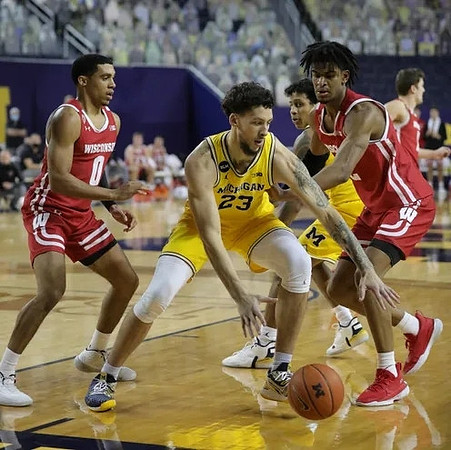 Brandon Johns Jr. (23) and Eli Brooks (55)