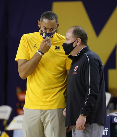 Juwan Howard and Wisconsin Head Coach Greg Gard