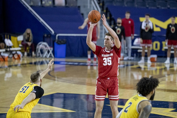 Austin Davis (51) and Isaiah Livers (2)