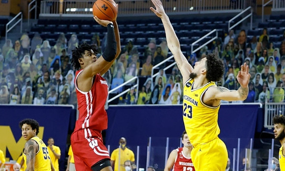 Eli Brooks (55) and Brandon Johns Jr. (23)